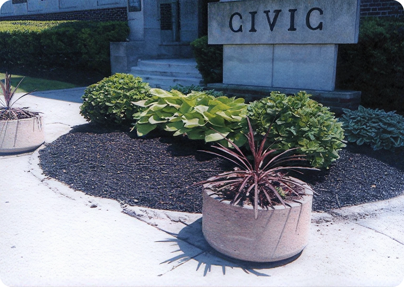 Planters and shrubs near Civic building.