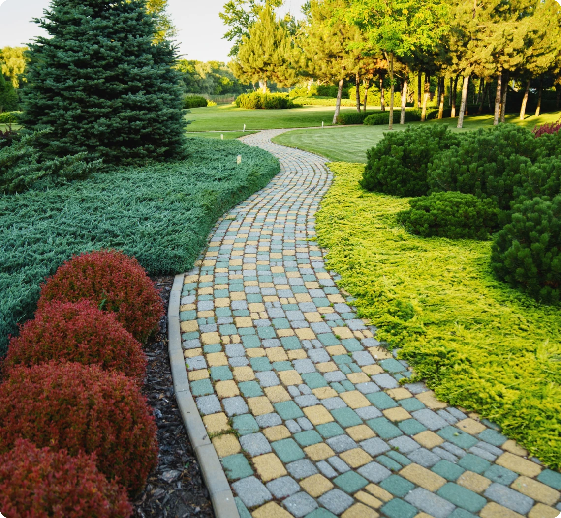 Colorful stone path through lush garden